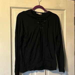Long sleeved black lace up hooded shirt size small